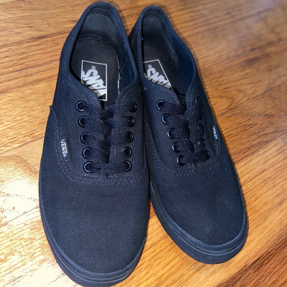 Vans all black slip ons